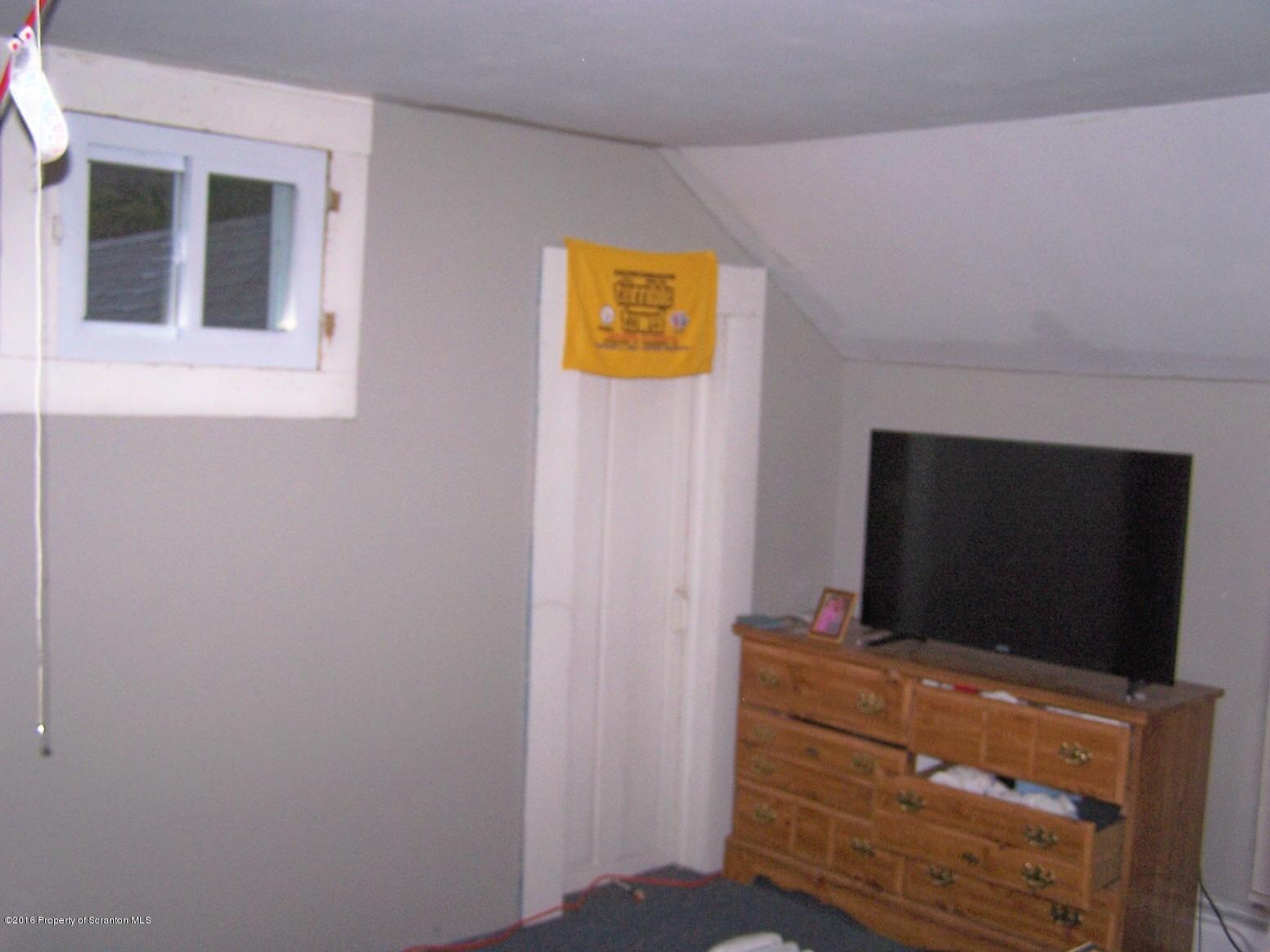 384 State Rte 2024 Montrose, PA 18801 - Photo 23 of 35 a living room with flat screen tv