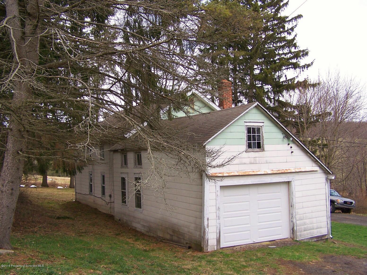 384 State Rte 2024 Montrose, PA 18801 - Photo 35 of 35 a front view of a house with a yard and garage