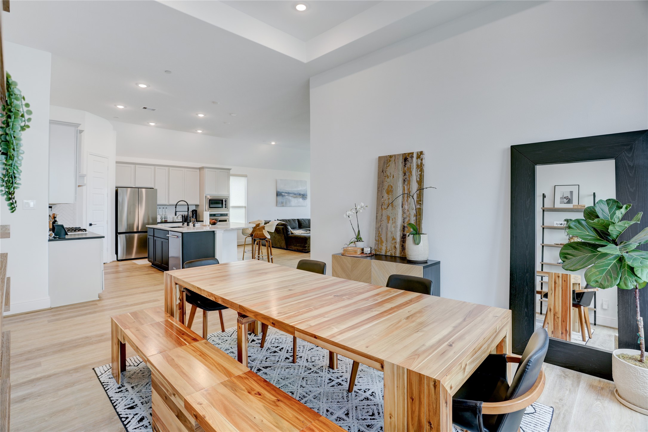 619 Rita Blanca Drive Webster, TX 77598 - Photo 11 of 44 The modern open-concept dining and kitchen area creates a seamless flow from meal prep to enjoying the labor of love.