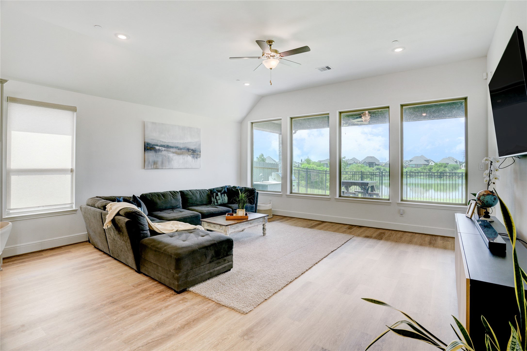 619 Rita Blanca Drive Webster, TX 77598 - Photo 12 of 44 Bright and spacious living room with large windows offers scenic views.