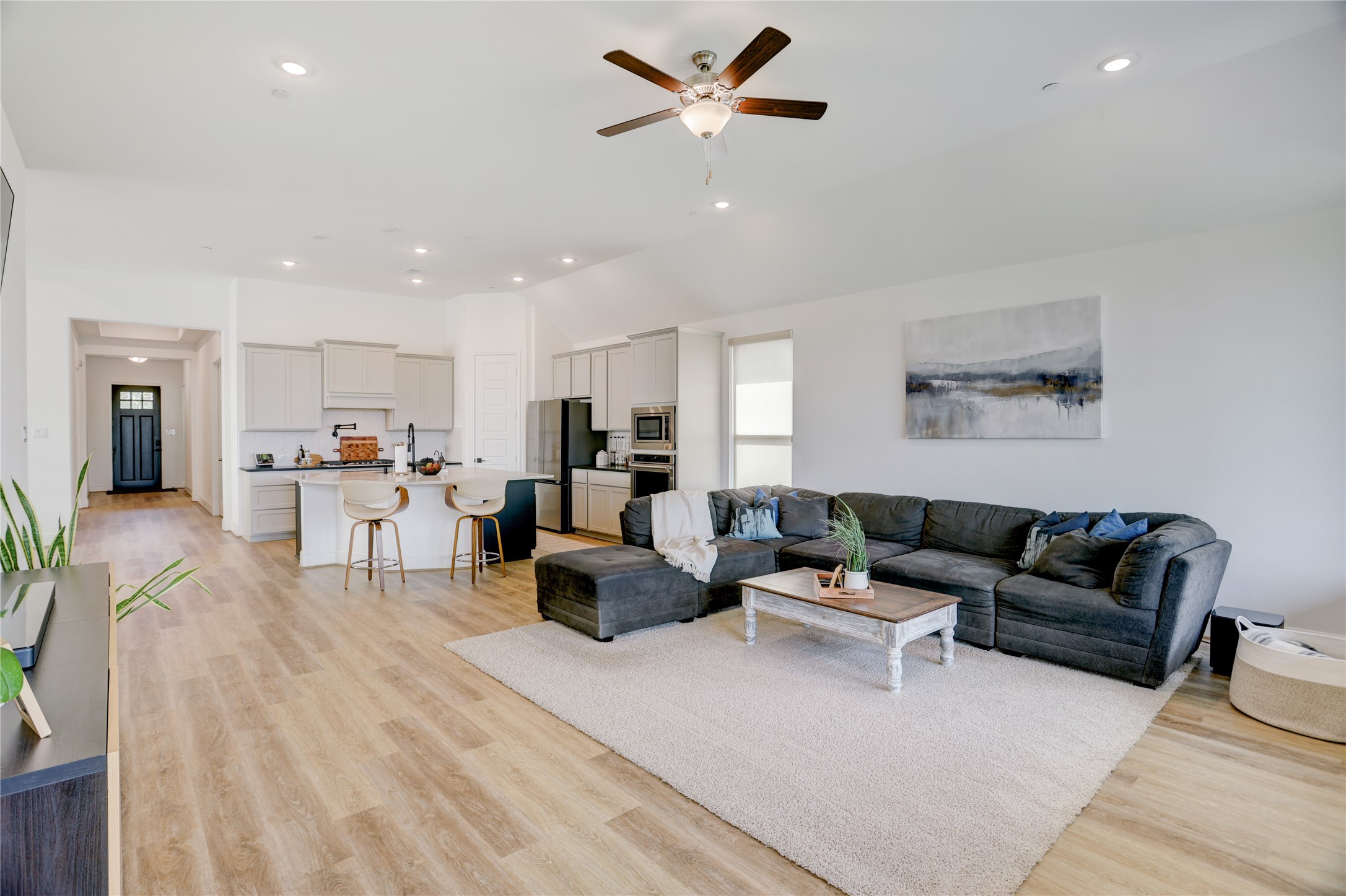 619 Rita Blanca Drive Webster, TX 77598 - Photo 13 of 44 This spacious open-concept living area is a bright and welcoming space for relaxation and entertaining.