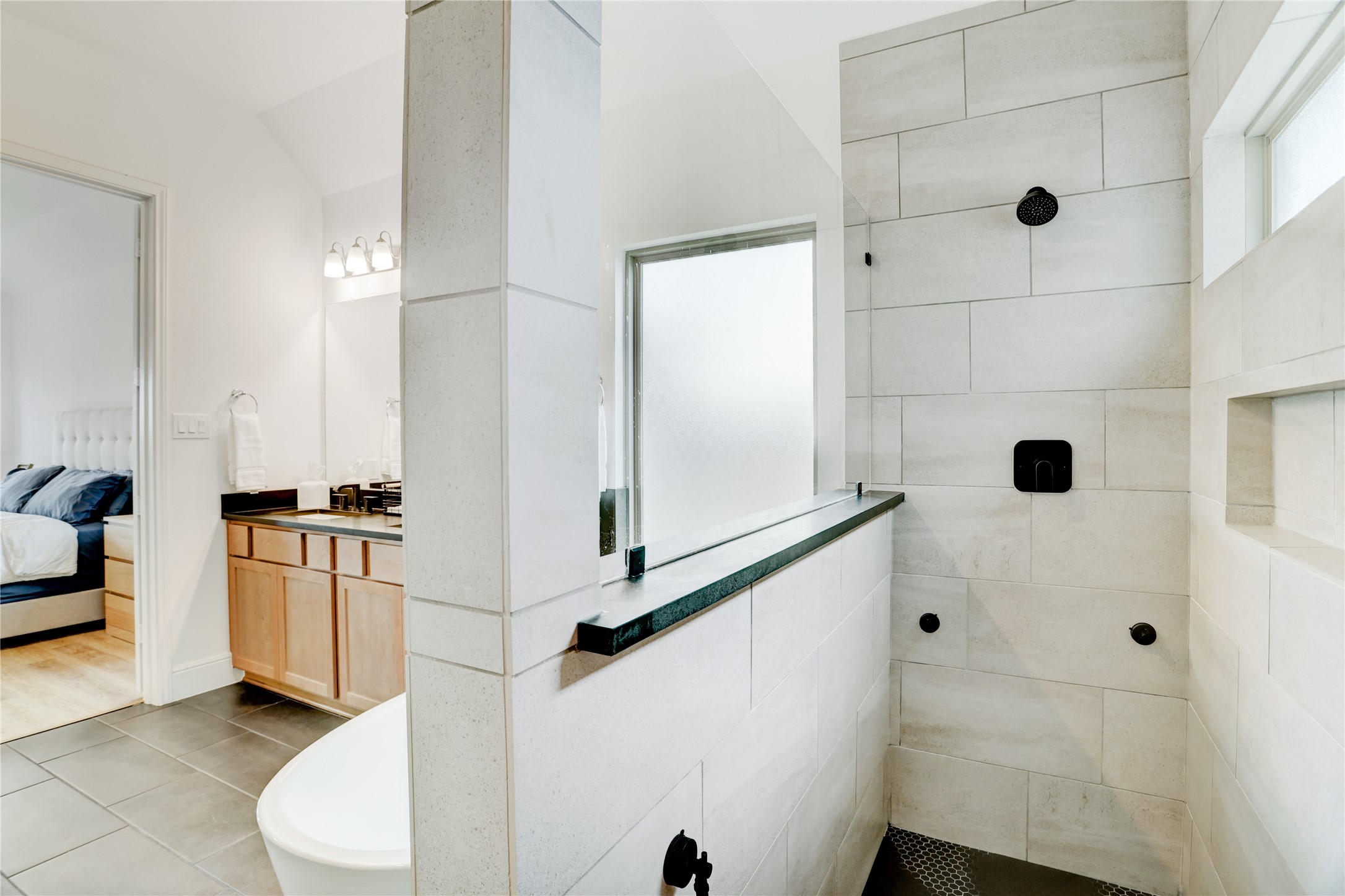 619 Rita Blanca Drive Webster, TX 77598 - Photo 19 of 44 This Texas sized walk-in shower with sleek black fixtures and large tiles will be the perfect start to your day.
