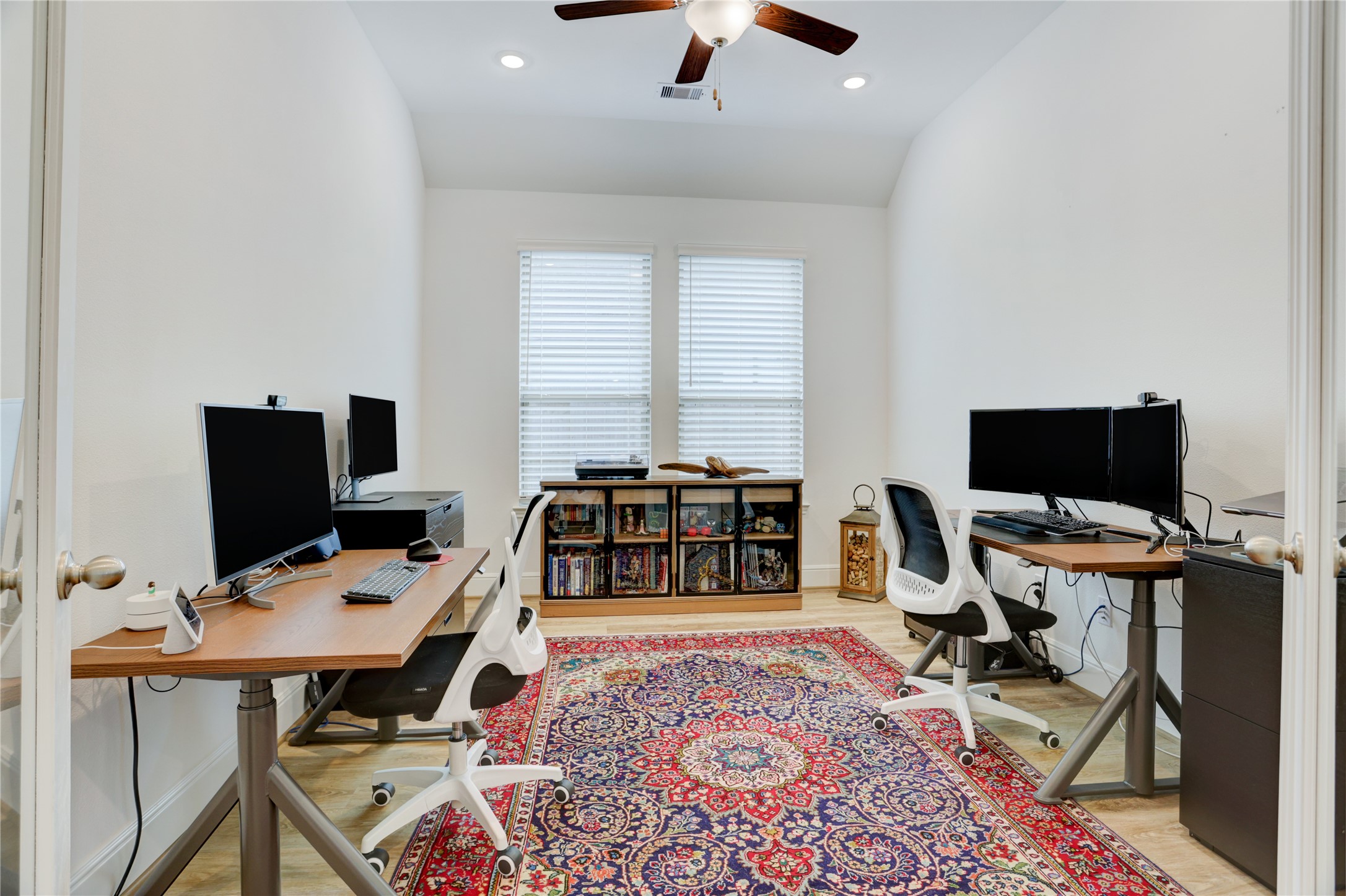 619 Rita Blanca Drive Webster, TX 77598 - Photo 28 of 44 This home office is spacious with large windows and french doors, creating a bright and inviting workspace.