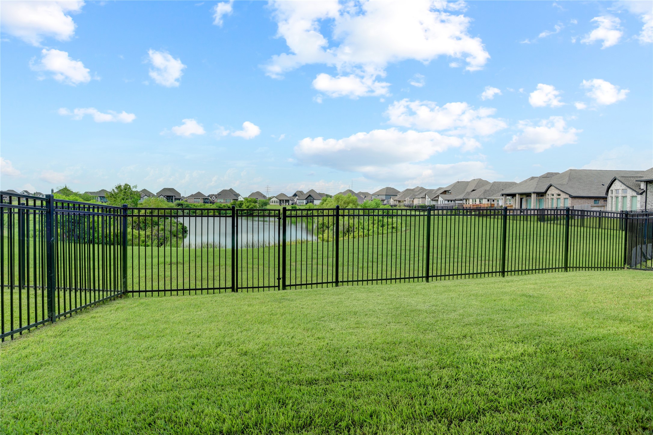 619 Rita Blanca Drive Webster, TX 77598 - Photo 30 of 44 The fenced backyard offers a peaceful and picturesque setting. Grass is digitally enhanced.