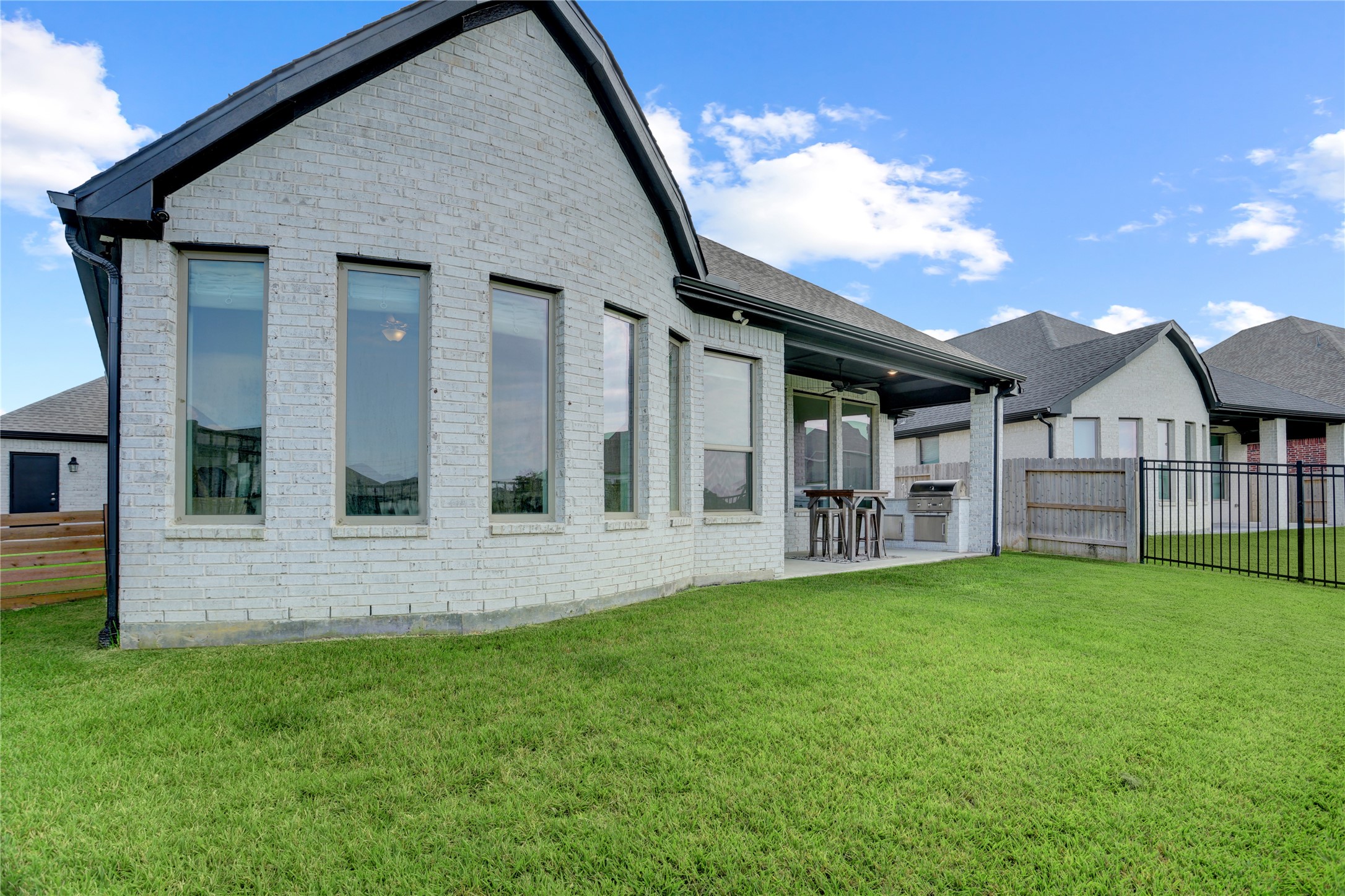 619 Rita Blanca Drive Webster, TX 77598 - Photo 33 of 44 The white brick is easy to maintain and the large windows are fitted for hurricane shields to protect your biggest investment.