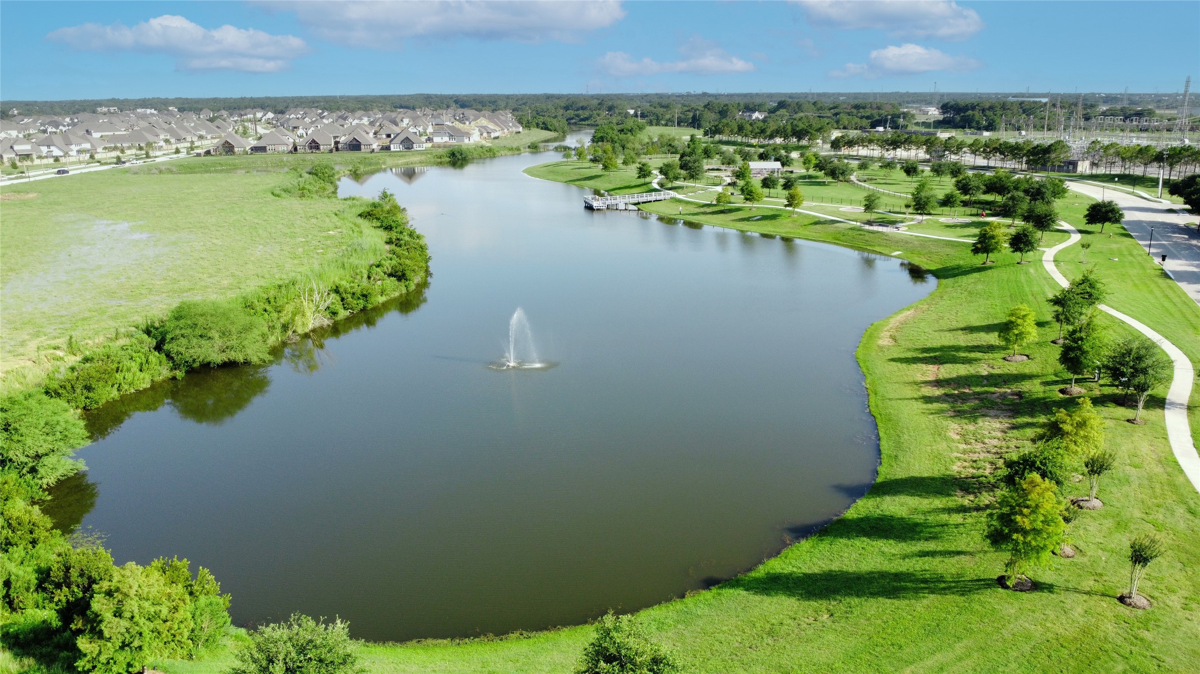 619 Rita Blanca Drive Webster, TX 77598 - Photo 39 of 44 The community lake is surrounded by walking trails and offers a statement fountain.