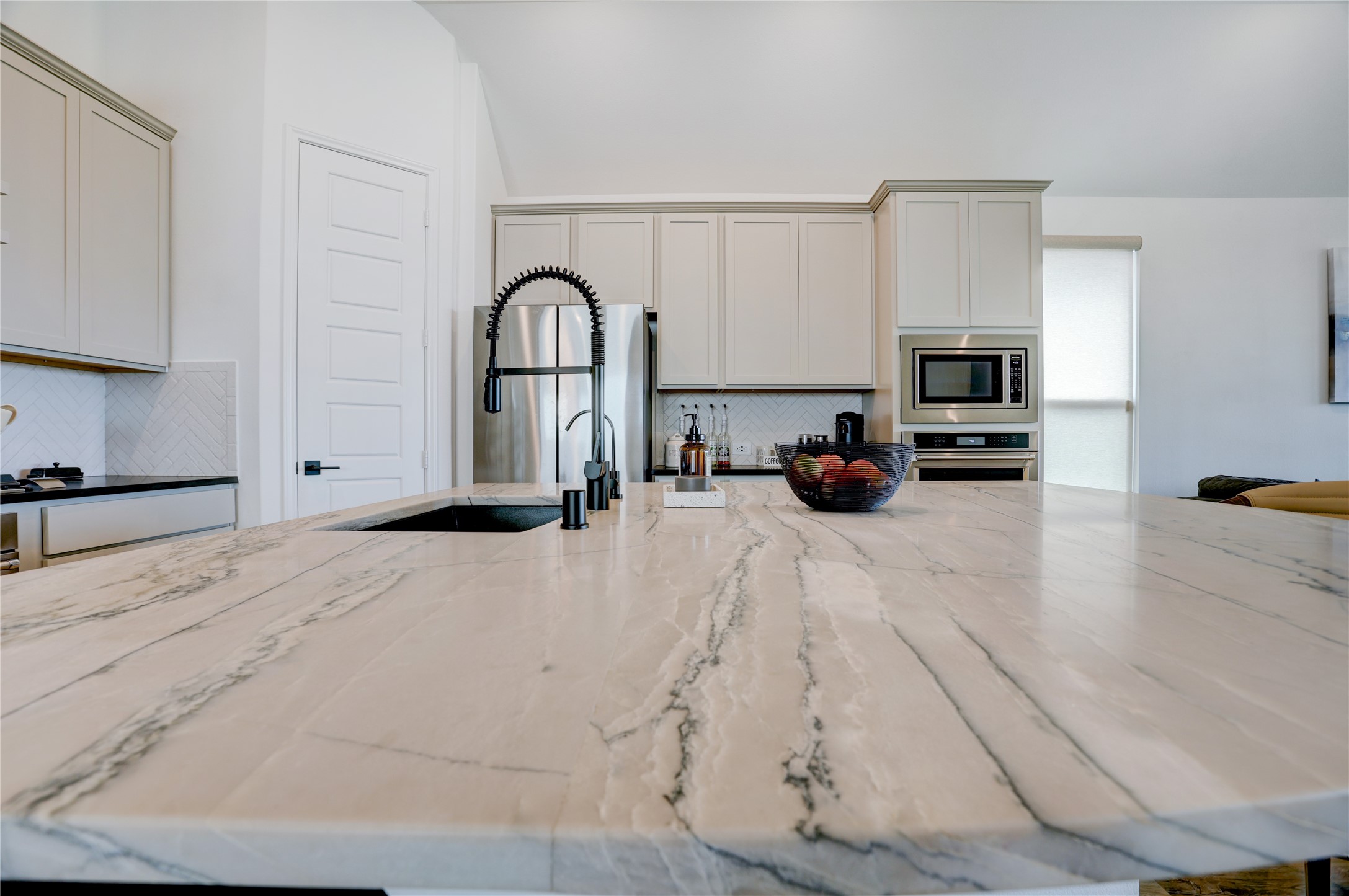 619 Rita Blanca Drive Webster, TX 77598 - Photo 7 of 44 The 'must-have' kitchen island is enhanced with elegant quartzite countertop with a modern sink and stylish faucet.