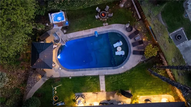 an aerial view of a house with garden space sitting space and swimming pool