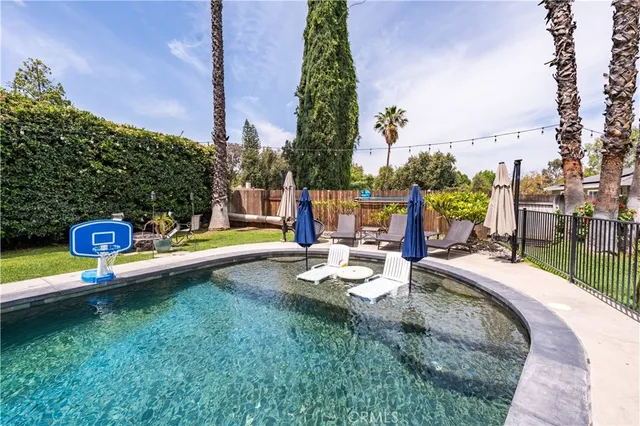 a view of a swimming pool with a patio