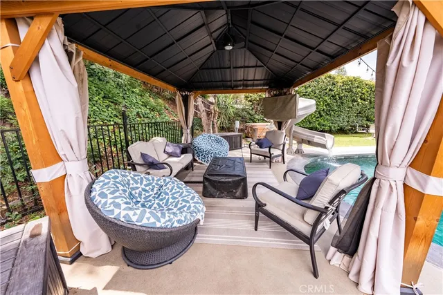 a outdoor living space with patio furniture and a potted plant