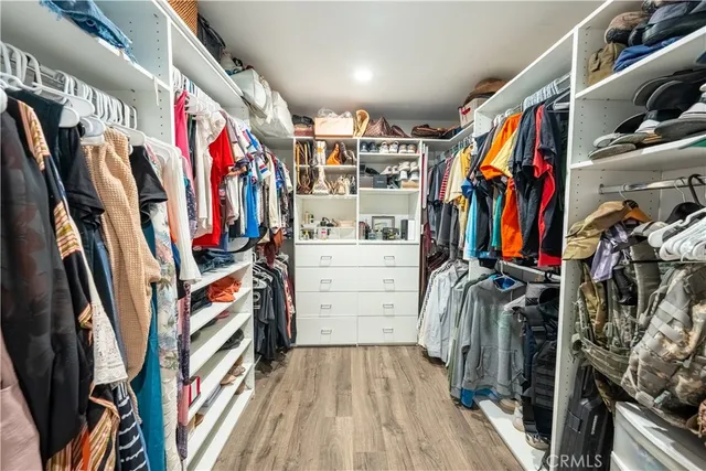 a bedroom with a bed couch and window