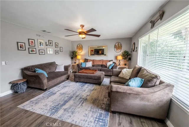 a bathroom with a granite countertop sink a mirror and shower