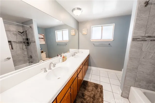 a bed room with a bed and a chair