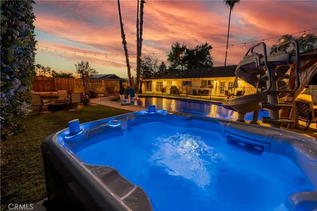 a view of swimming pool with outdoor seating
