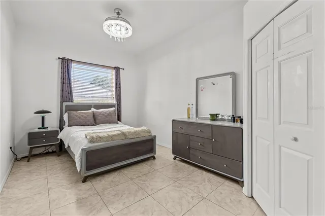 a bedroom with a bed and a table