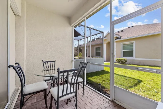 a view of a chairs and table in the balcony