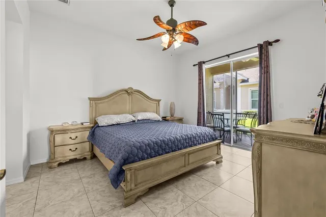 a bedroom with a bed dresser and a window