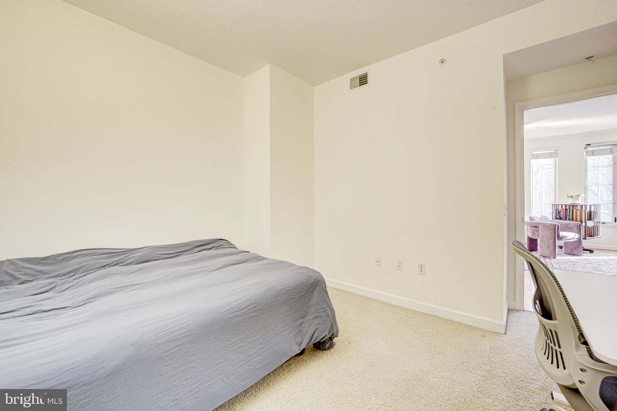 1441 Rhode Island Avenue Northwest, Unit 419 Washington, DC 20005 - Photo 15 of 25 a bedroom with a bed and a dresser in it