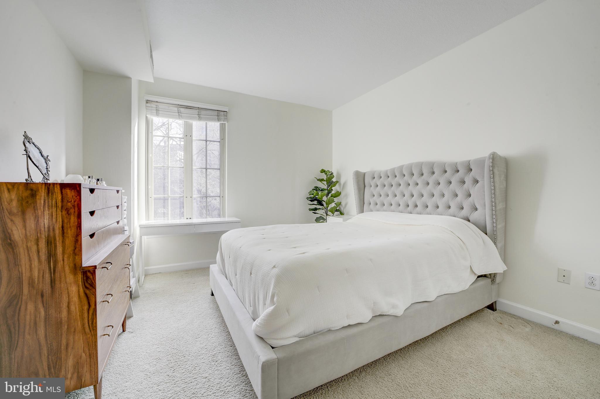 1441 Rhode Island Avenue Northwest, Unit 419 Washington, DC 20005 - Photo 19 of 25 a bedroom with bed and window