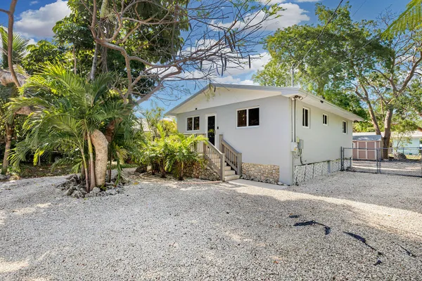a view of a house with a tree and a tree