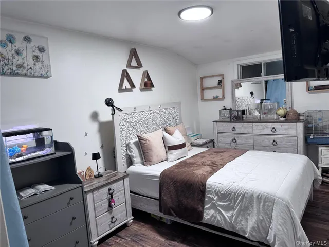 a room with a bed and furniture