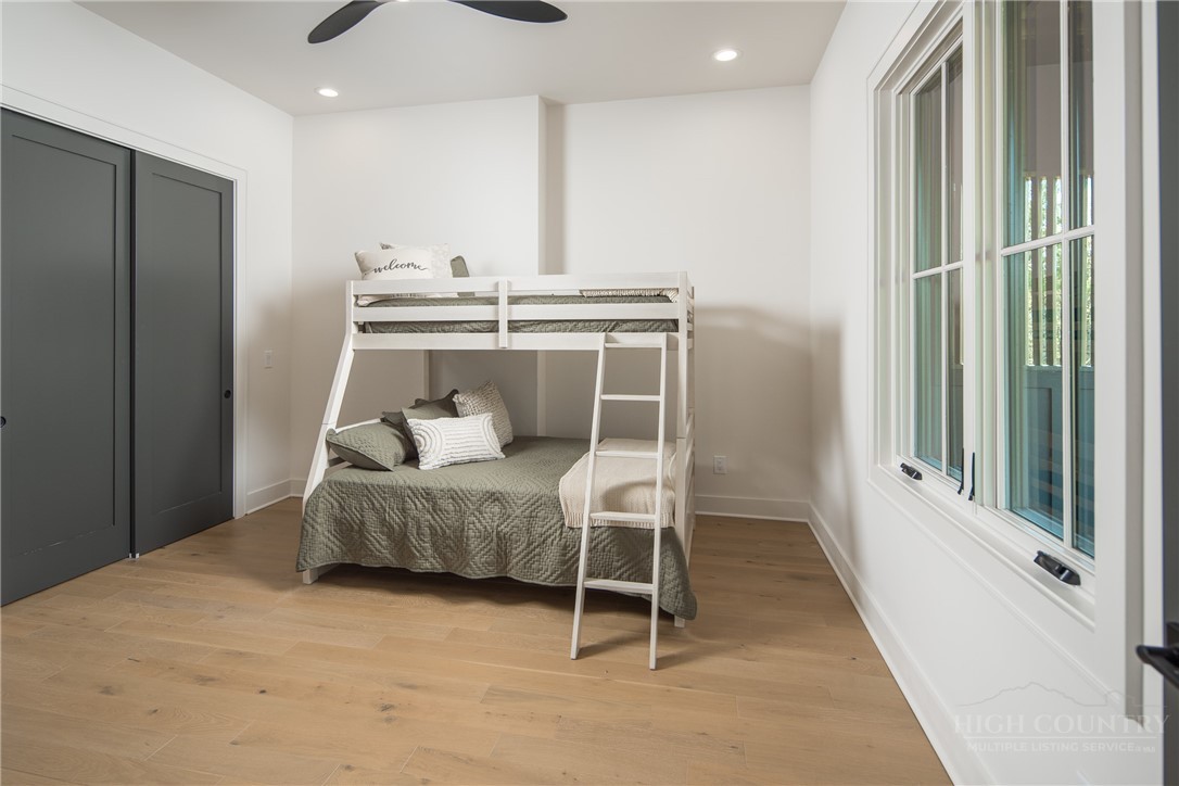 359 Calico Court Boone, NC 28607 - Photo 17 of 50 a bedroom with a bed and a window