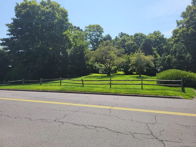 a view of a tennis ground with a small yard