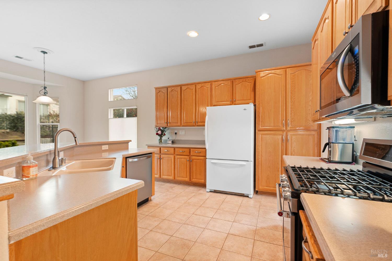 802 Summerset Drive Rio Vista, CA 94571 - Photo 11 of 74 corian counters and stainless appliances in kitchen