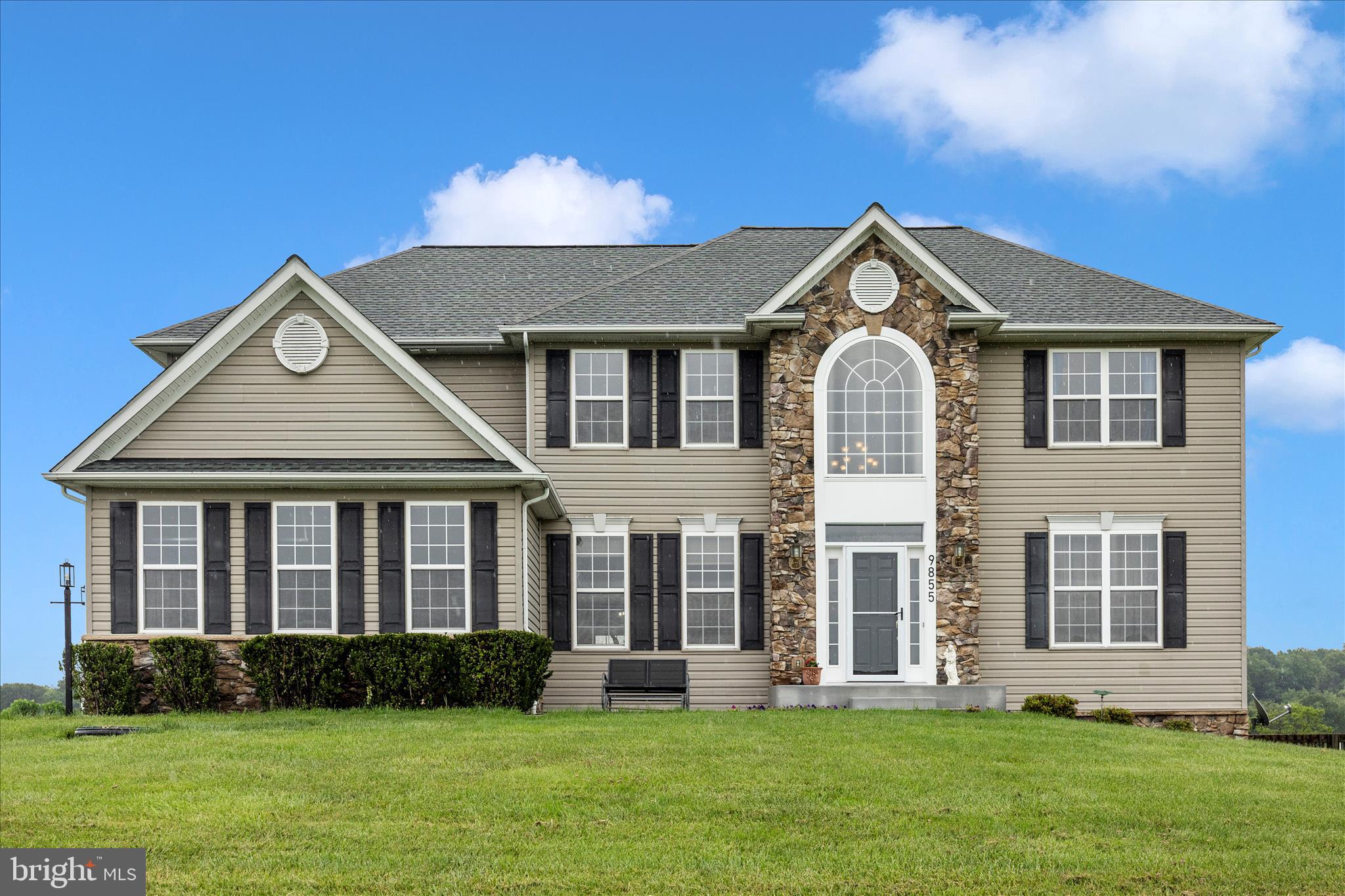 9855 McKinstry Mill Road New Windsor, MD 21776 - Photo 5 of 76 a front view of a house with a yard
