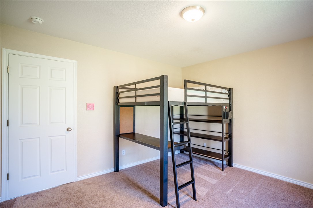 1016 Clark Street Mexia, TX 76667 - Photo 17 of 36 a view of a room with racks on the wall