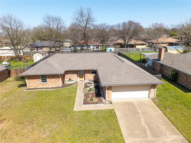 a view of a swimming pool and trees in the background