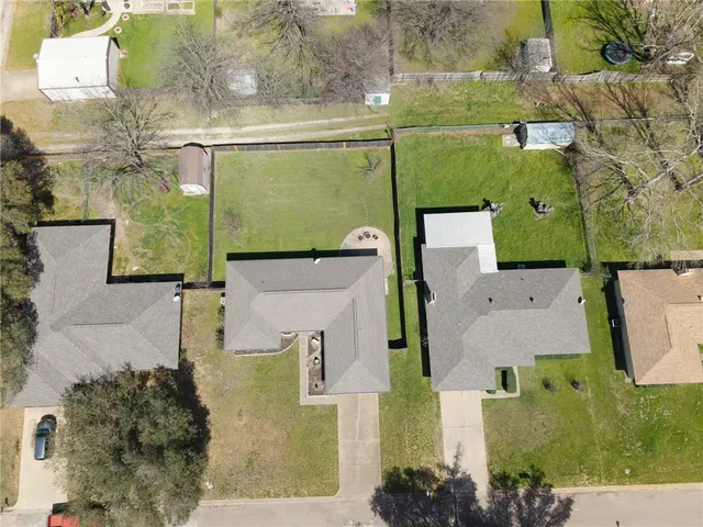 a swimming pool with outdoor seating and yard