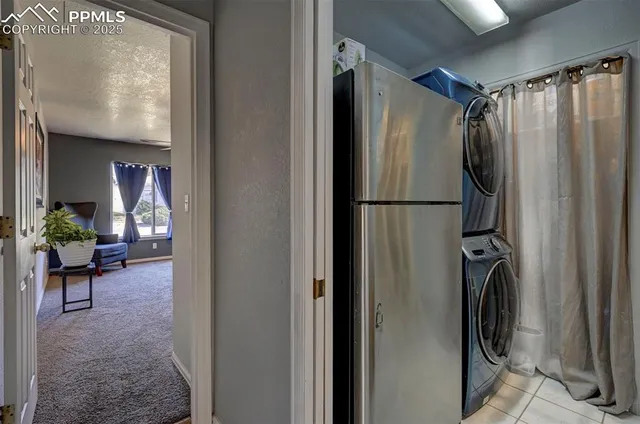 a work room with furniture and a flat screen tv