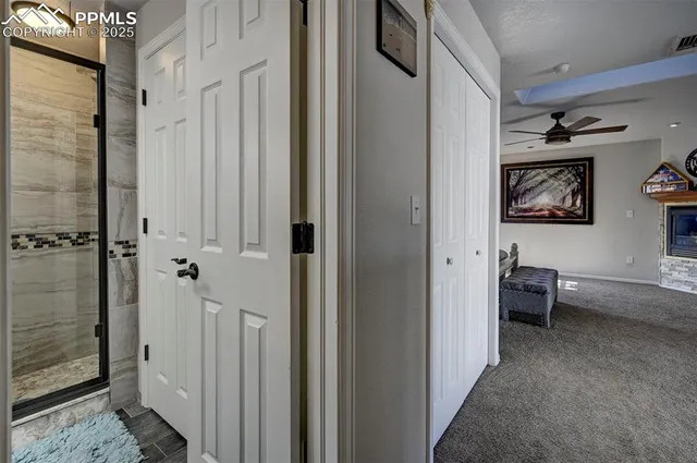 a bathroom with a tub a sink and mirror