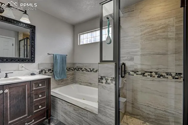 a bathroom with a bathtub and a shower
