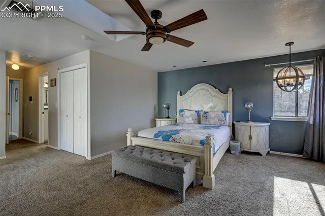 a bedroom with a bed and a television in it