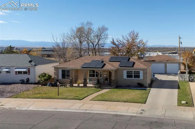a view of multiple houses with a yard