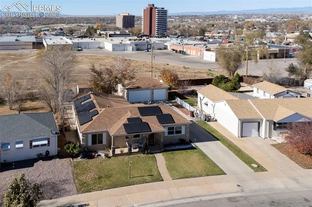 an aerial view of a house with a yard lake view and mountain view