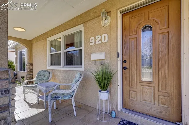 a view of front door with outdoor seating