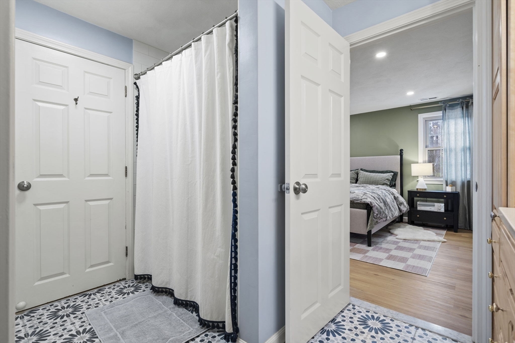 4 Apple Ridge Road, Unit 6 Maynard, MA 01754 - Photo 16 of 40 a bedroom with a bed and a shower