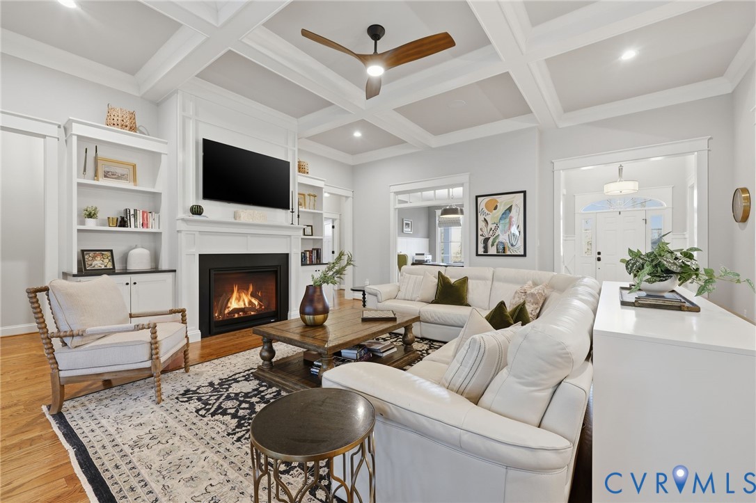 7201 Amarone Way New Kent, VA 23124 - Photo 20 of 46 a living room with furniture a flat screen tv and a fireplace