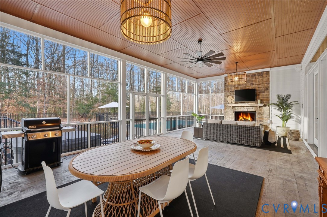 7201 Amarone Way New Kent, VA 23124 - Photo 40 of 46 a view of a dining room with furniture window and wooden floor