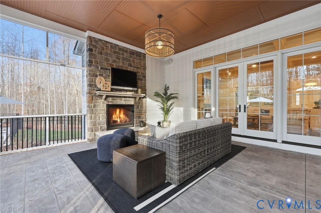 7201 Amarone Way New Kent, VA 23124 - Photo 41 of 46 a living room with furniture a flat screen tv and a fireplace