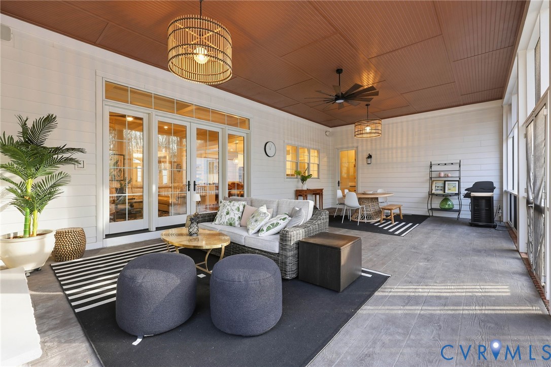 7201 Amarone Way New Kent, VA 23124 - Photo 42 of 46 a living room with furniture chandelier and a large window