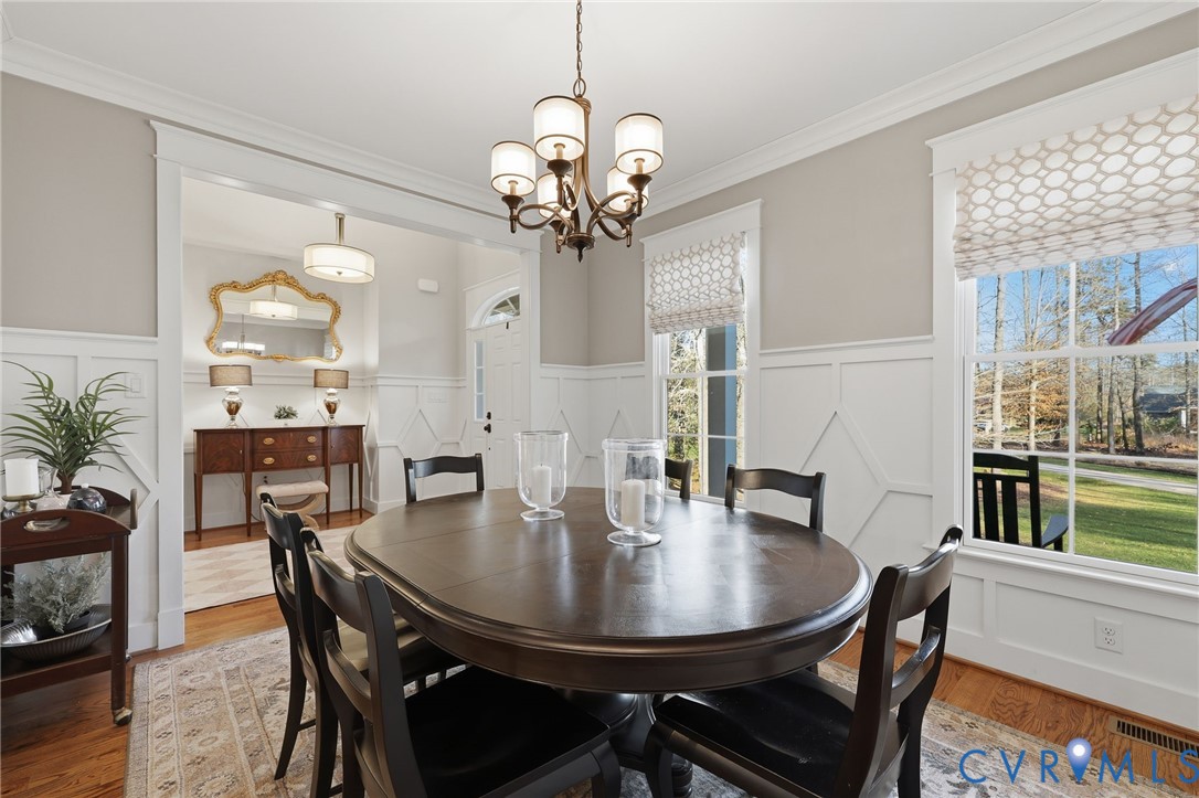 7201 Amarone Way New Kent, VA 23124 - Photo 10 of 46 a view of a dining room with furniture and wooden floor