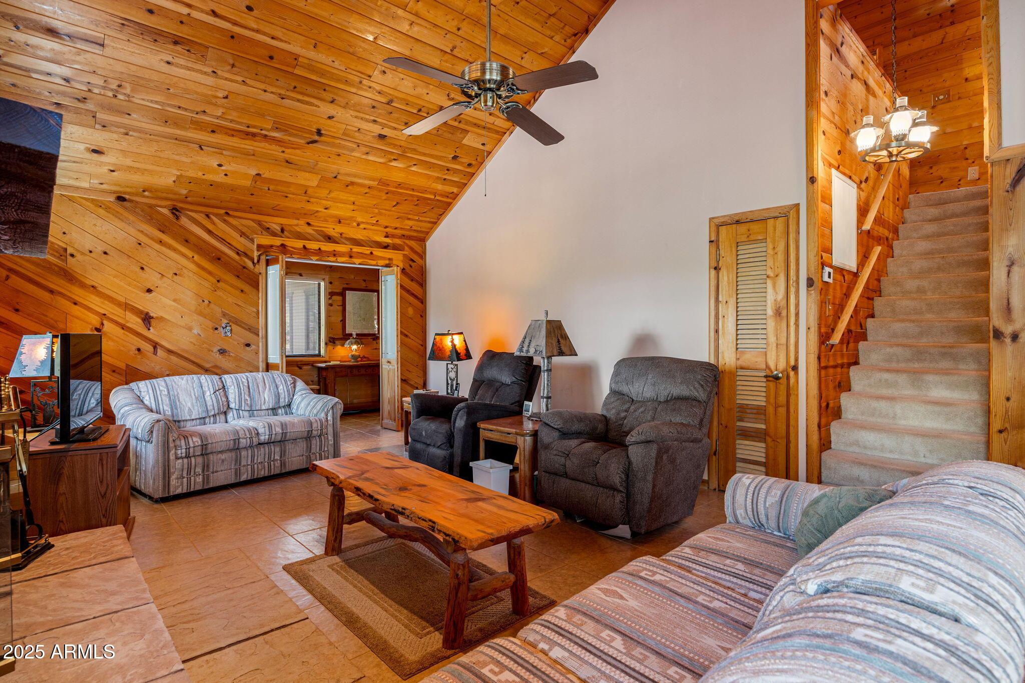 2240 Roundabout Way Overgaard, AZ 85933 - Photo 8 of 47 a living room with furniture and a couch