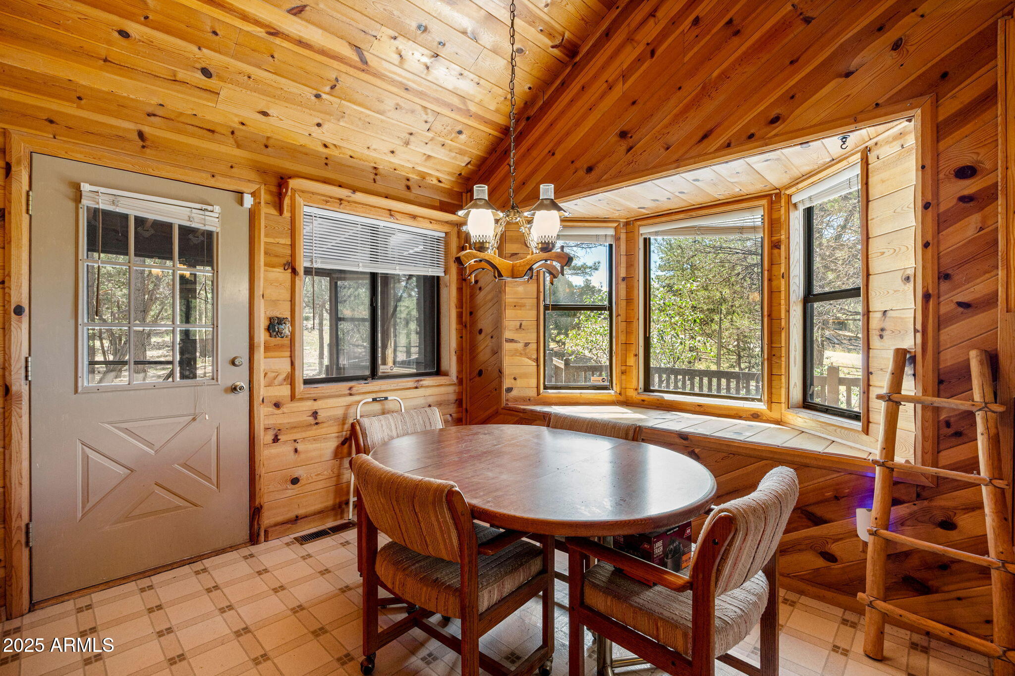 2240 Roundabout Way Overgaard, AZ 85933 - Photo 12 of 47 a dining room with furniture and window