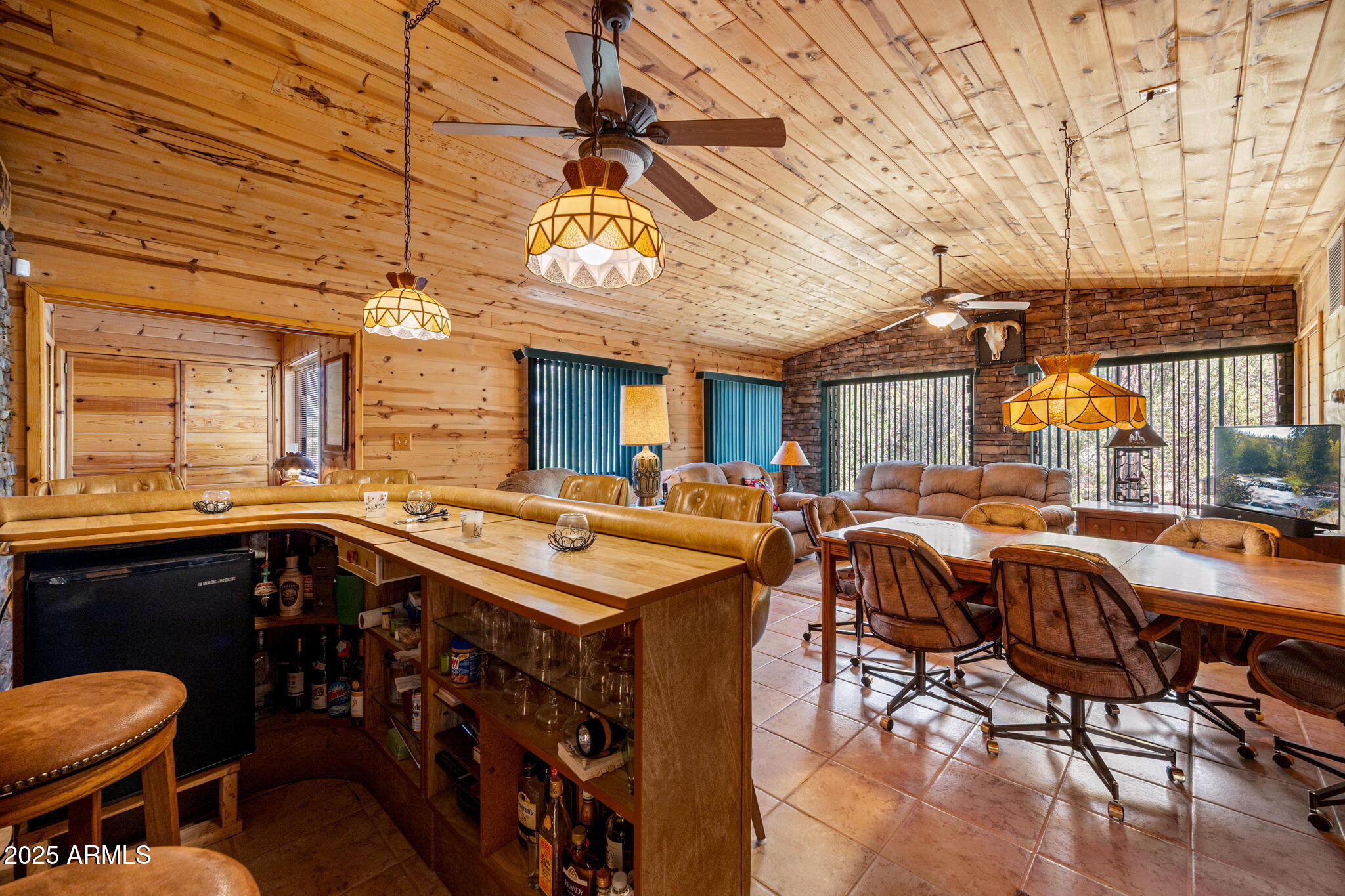 2240 Roundabout Way Overgaard, AZ 85933 - Photo 14 of 47 a view of a dining area with furniture window and wooden floor