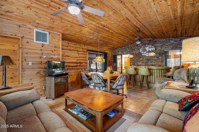 a kitchen with stainless steel appliances a stove a sink dishwasher and cabinets with wooden floor