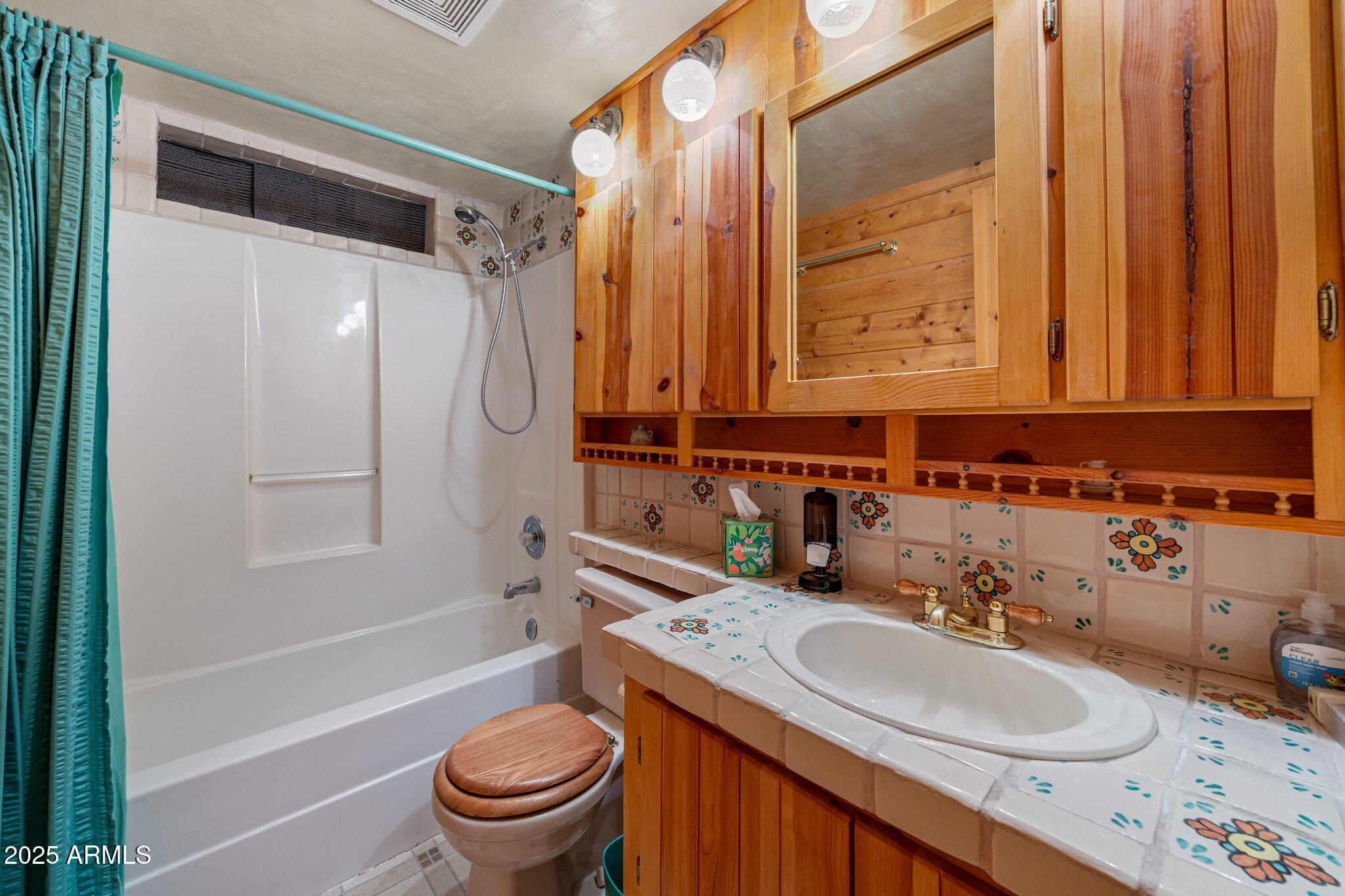 2240 Roundabout Way Overgaard, AZ 85933 - Photo 20 of 47 a bathroom with a sink a toilet and a mirror